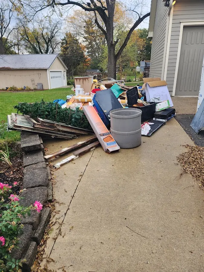 Dumpster being loaded with debris for Residential Dumpster Rental in Zuni Pueblo